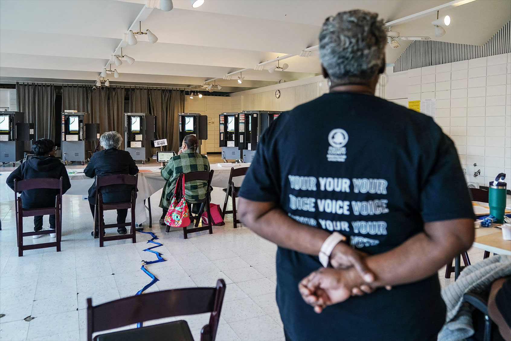 Poll workers wait for voters at a precinct during the presidential primary elections in Atlanta, Georgia, on March 12, 2024. (ELIJAH NOUVELAGE/AFP via Getty Images)