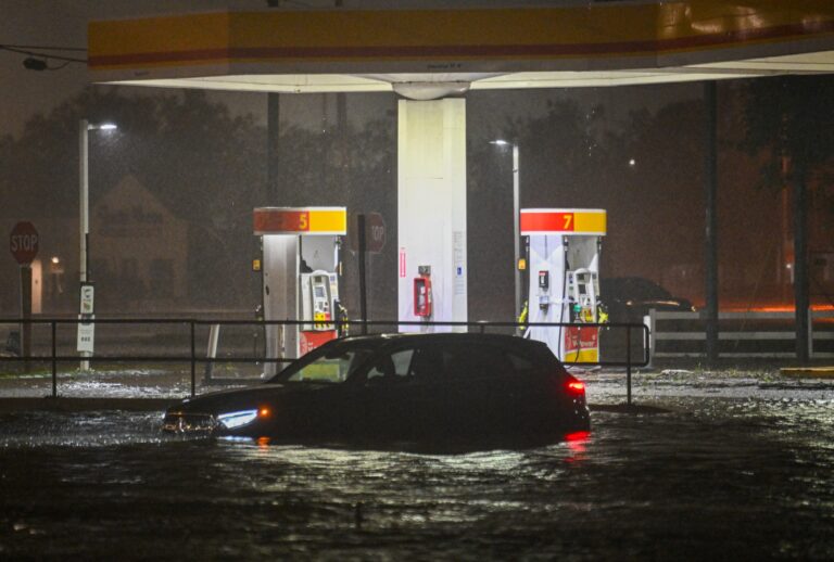 A vehicule is stranded on a water-flooded street after Hurricane Milton made landfall in Brandon, Florida on October 9, 2024. (MIGUEL J. RODRIGUEZ CARRILLO/AFP via Getty Images)