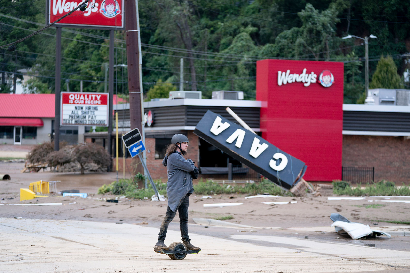 Kyle Gardner explorers storm damage near the Biltmore Village in the aftermath of Hurricane Helene on September 28, 2024 in Asheville, North Carolina. (Sean Rayford/Getty Images)