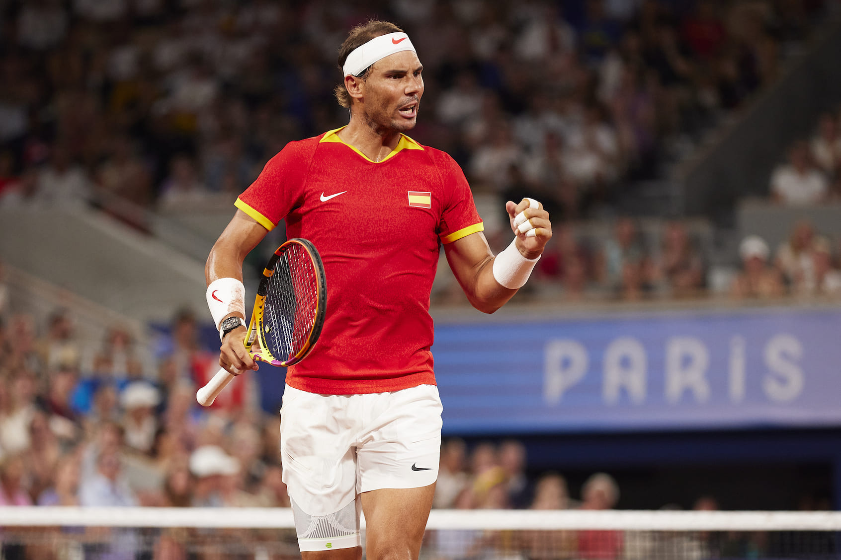 Rafael Nadal of Team Spain celebrates with partner (out of frame) Carlos Alcaraz of Team Spain against Austin Krajicek of Team United States and Rajeev Ram of Team United States during the Men's Doubles Quarter-final match on day five of the Olympic Games Paris 2024 at Roland Garros on July 31, 2024 in Paris, France. (Photo by Quality Sport Images/Getty Images)
