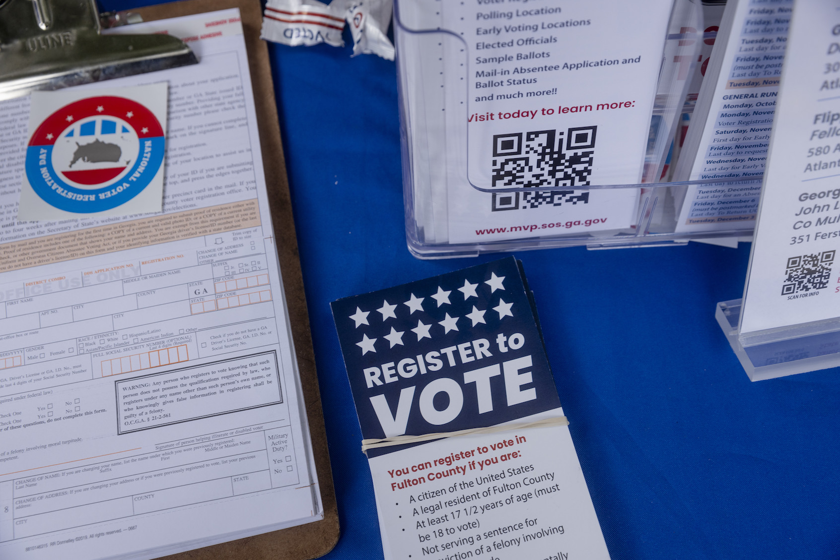 Informational materials and voter registration forms on the table at a volunteer-run voter registration booth on the campus of Morehouse College in Atlanta, Georgia on Tuesday, September 17, 2024. Photo by David Walter Banks