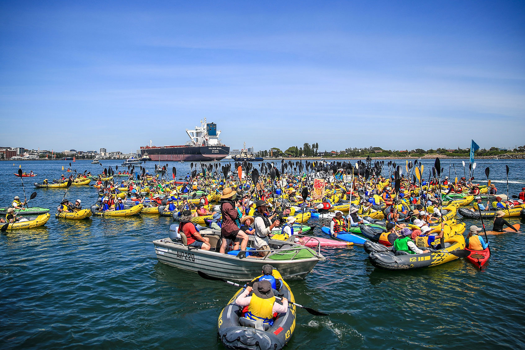 Climate protestors in kayaks continue their attempt to block access to Newcastle coal port during the People's Blockade on November 24, 2024 in Newcastle, Australia. (Roni Bintang/Getty Images)