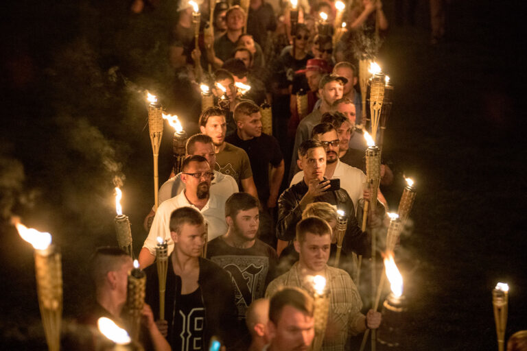 Chanting "White lives matter! You will not replace us! and Jews will not replace us!" several hundred white nationalists and white supremacists carrying torches marched in a parade through the University of Virginia campus on the night of August 11, 2017. (Evelyn Hockstein/For The Washington Post via Getty Images)
