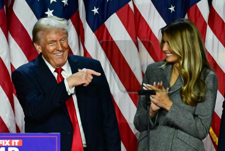 President-elect Donald Trump points to his wife Melania Trump during an election night event in West Palm Beach, Florida, on November 6, 2024. (JIM WATSON/AFP via Getty Images)