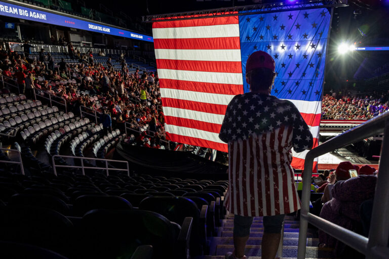 Attendees take their seats as they arrive for a campaign rally for former US President and Republican presidential candidate Donald Trump at First Horizon Coliseum in Greensboro, North Carolina, on November 2, 2024. (CHRISTIAN MONTERROSA/AFP via Getty Images)