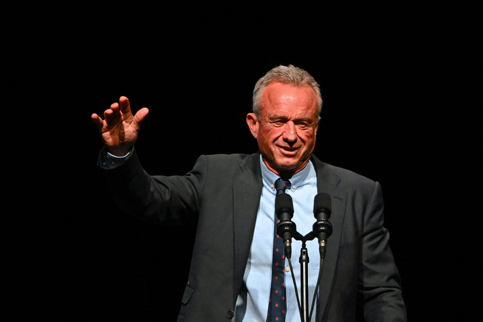 Former Republican presidential candidate Robert F. Kennedy Jr. speaks ahead of a live interview with US commentator Tucker Carlson and former US President and Republican presidential candidate Donald Trump, during the finale of the Tucker Carlson Live Tour at Desert Diamond Arena in Glendale, Arizona, on October 31, 2024. (PATRICK T. FALLON/AFP via Getty Images)