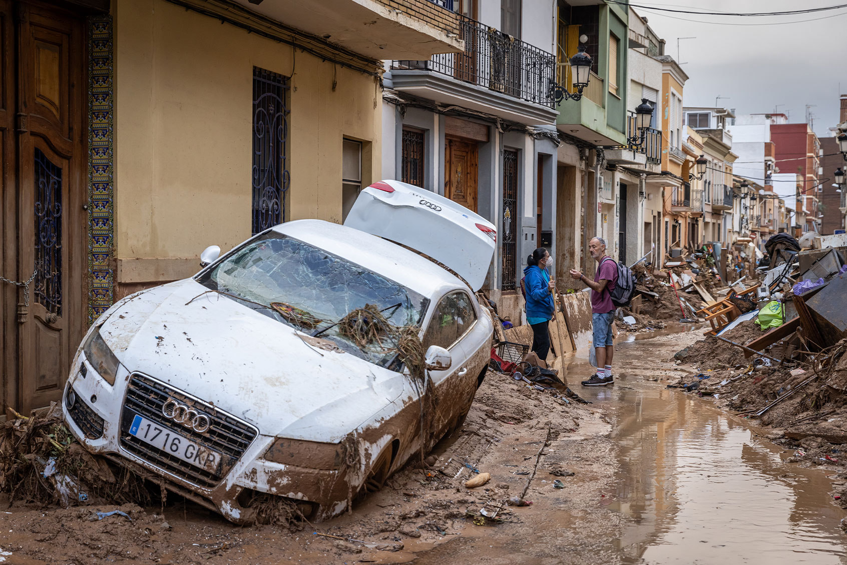 People speak in the street after heavy rain and flooding hit large parts of the country on November 04, 2024 in Paiporta, Spain. (Aldara Zarraoa/Getty Images)