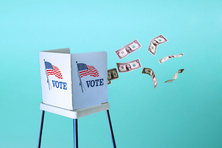 Dollar bills floating out of a voting booth (Photo illustration by Salon/Getty Images)