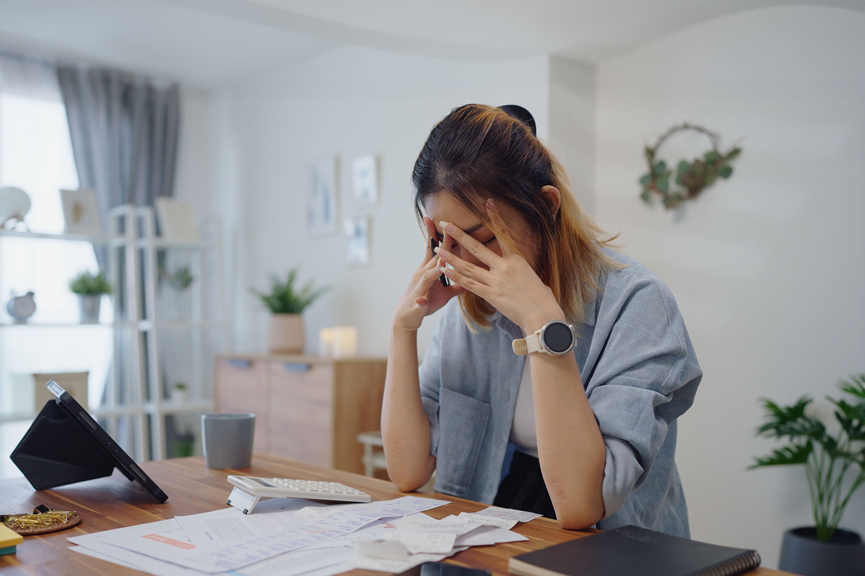 Woman stressed out with her finances (Getty Images/Happy Kikky)