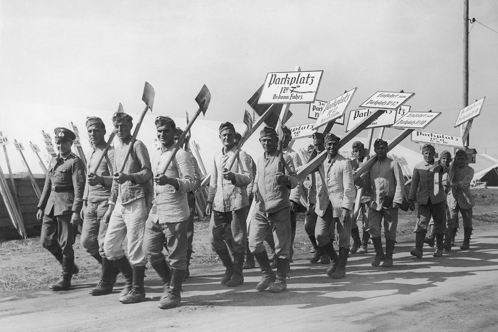 A detachment of German soldiers on their way to install parking signs in preparation for the 8th Congress of the Nazi Party at Nuremberg, 3rd September 1936. (FPG/Hulton Archive/Getty Images)
