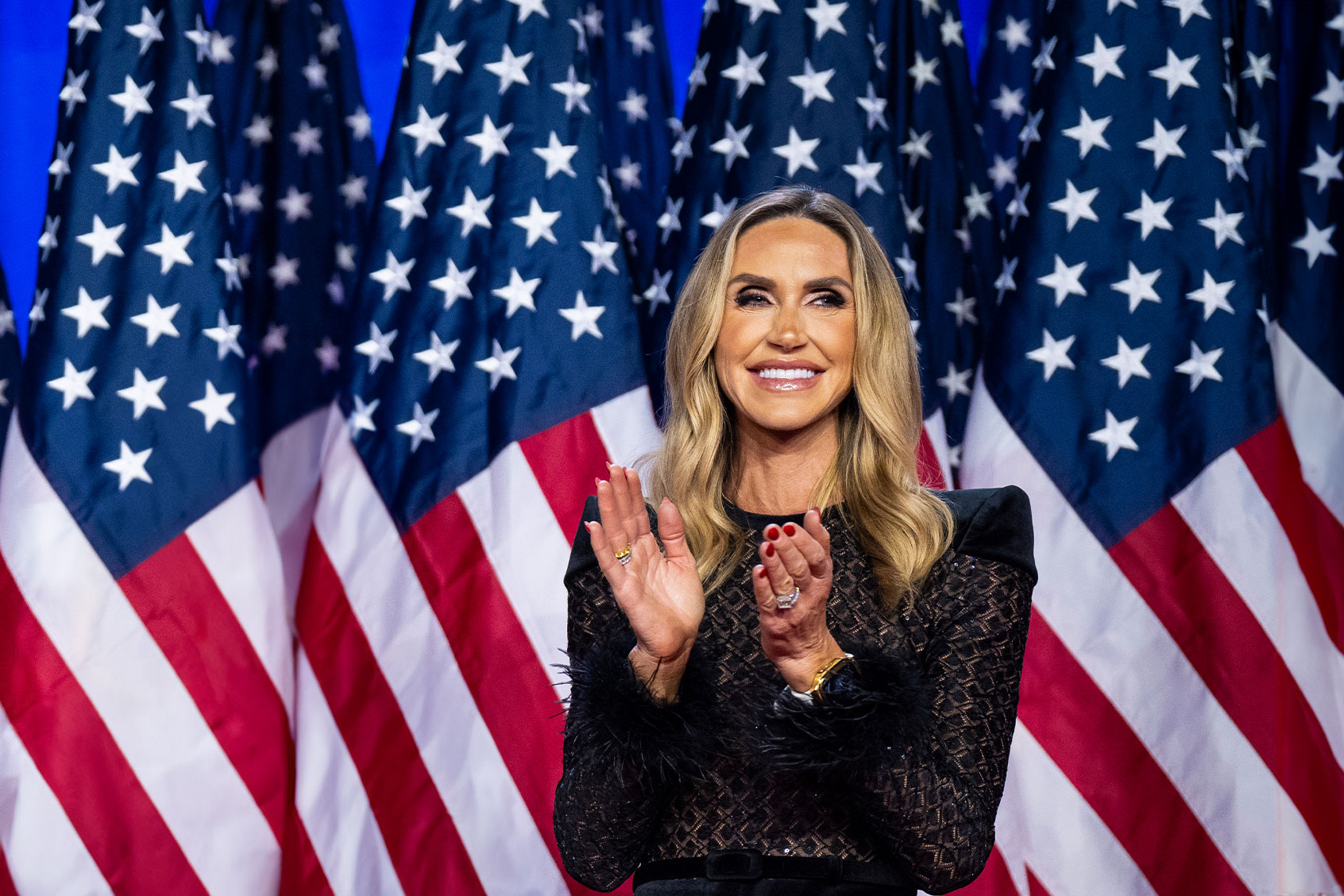 Lara Trump listens as Republican presidential nominee former President Donald Trump speaks after being declared the winner during an election night watch party at the Palm Beach County Convention Center in West Palm Beach, Florida in the early hours of Wednesday, Nov. 06, 2024. (Jabin Botsford/The Washington Post via Getty Images)