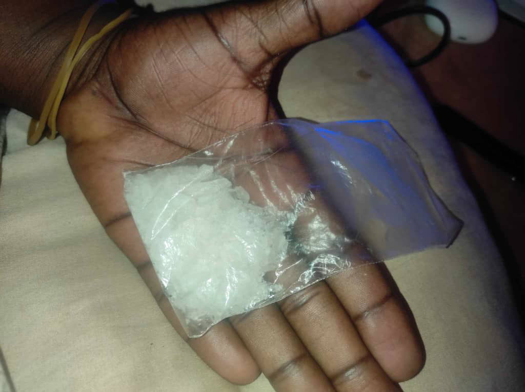 Abande holding a bag of meth