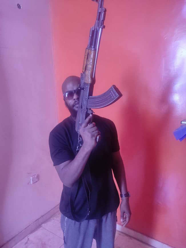 Abande holding a gun
