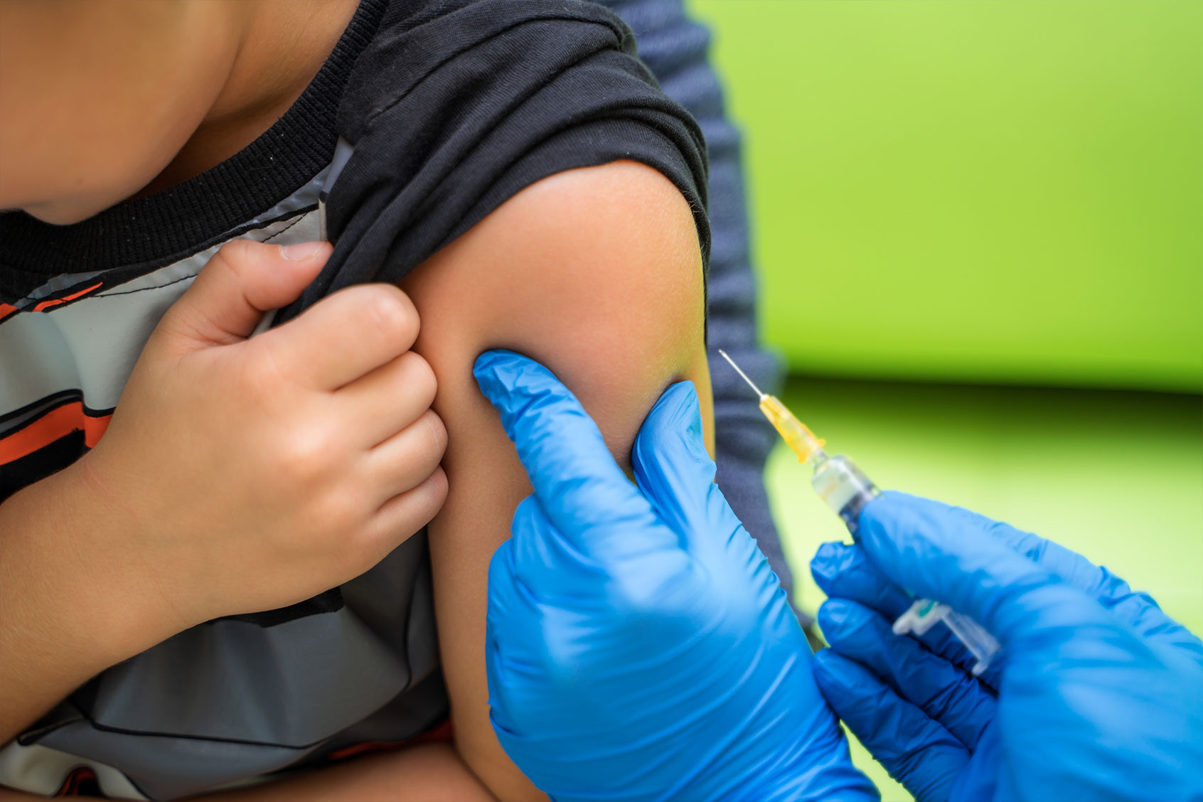 Pediatrician administers a vaccination to a small boy (Getty Images/Vadym Terelyuk)
