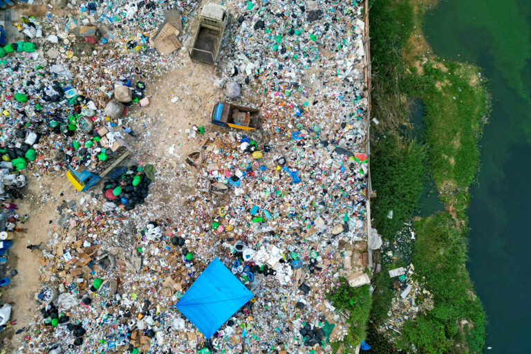 An aerial view shows plastic waste at a landfill on the outskirts of Bengaluru on November 23, 2024. (IDREES MOHAMMED/AFP via Getty Images)