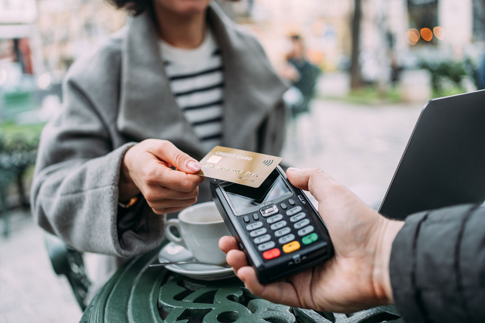 A customer making a contactless payment using a credit card. (Getty Images/VioletaStoimenova)