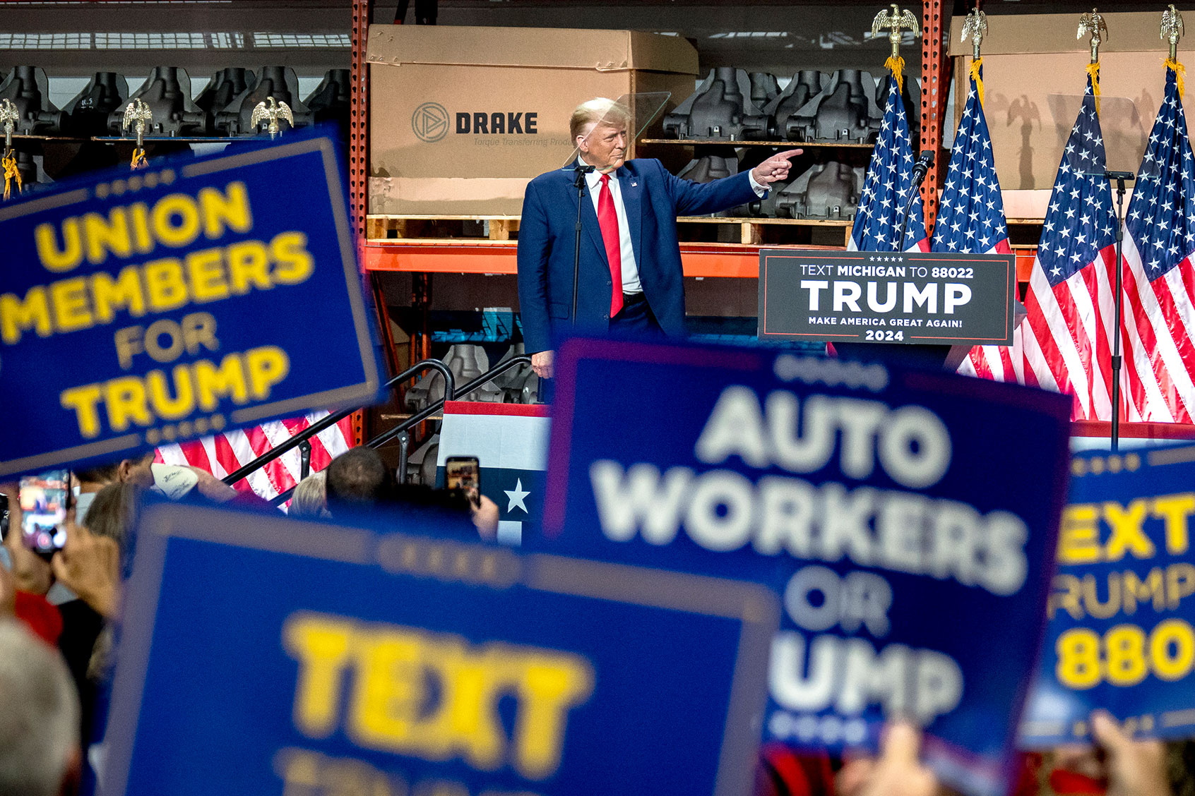 Former president Donald Trump points at Drake Enterprises in Clinton Township, Michigan on September 27, 2023. (Nic Antaya for The Washington Post via Getty Images)