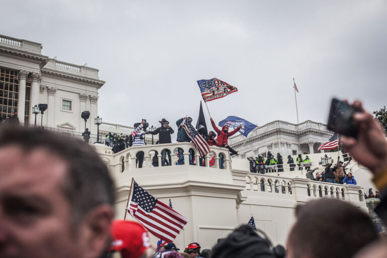 Trump insurrectionists cheer as more of the crowd gains access to the U.S. Capitol on January 06, 2021 in Washington, DC. (Shay Horse/NurPhoto via Getty Images)