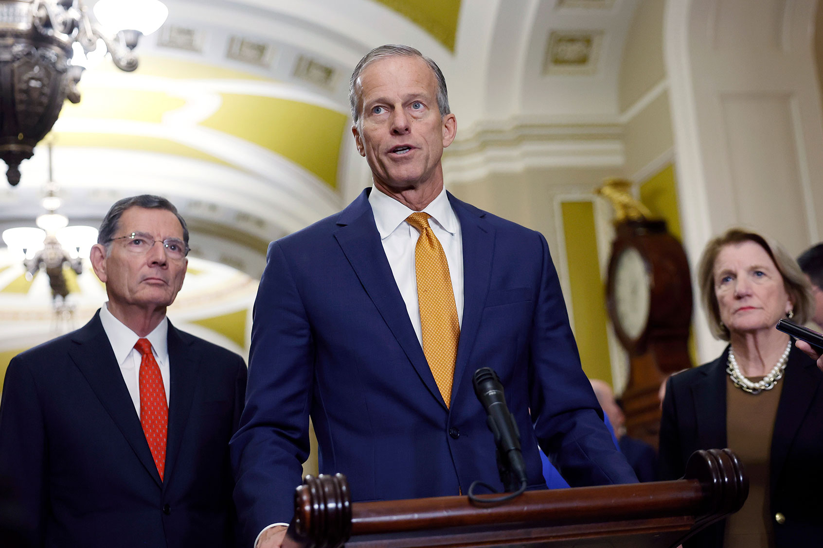 U.S. Senate Minority Whip John Thune (R-SD) (C) speaks alongside Sen. John Barrasso (R-WY) (L) and Sen. Shelley Moore Capito (R-WV) (R) during a news conference following the weekly Senate Republican policy luncheon at the U.S. Capitol on December 10, 2024 in Washington, DC. (Kevin Dietsch/Getty Images)