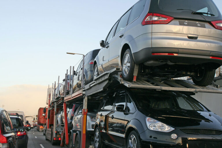 New cars transportation on car carrier trailer (Getty Images/Lya_Cattel)