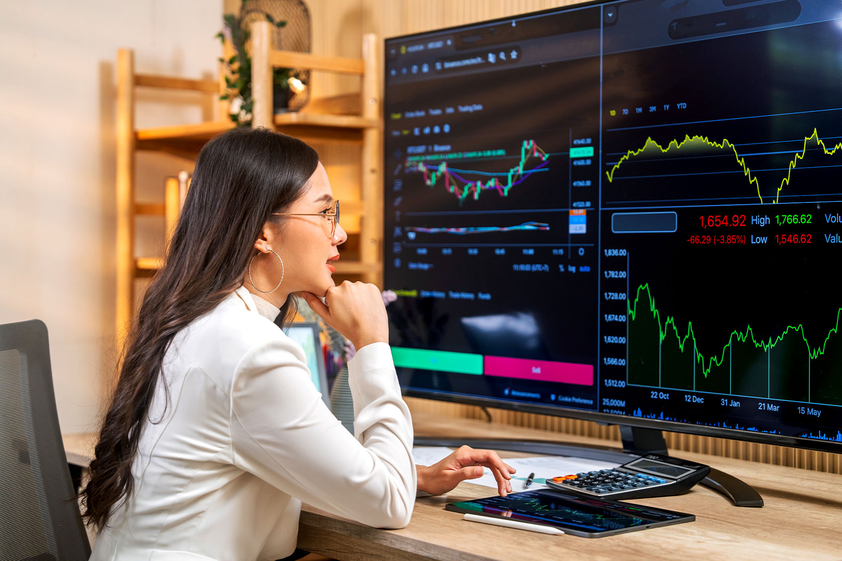 Woman Analyzing Stock Market Trends (Getty Images/Witthaya Prasongsin)