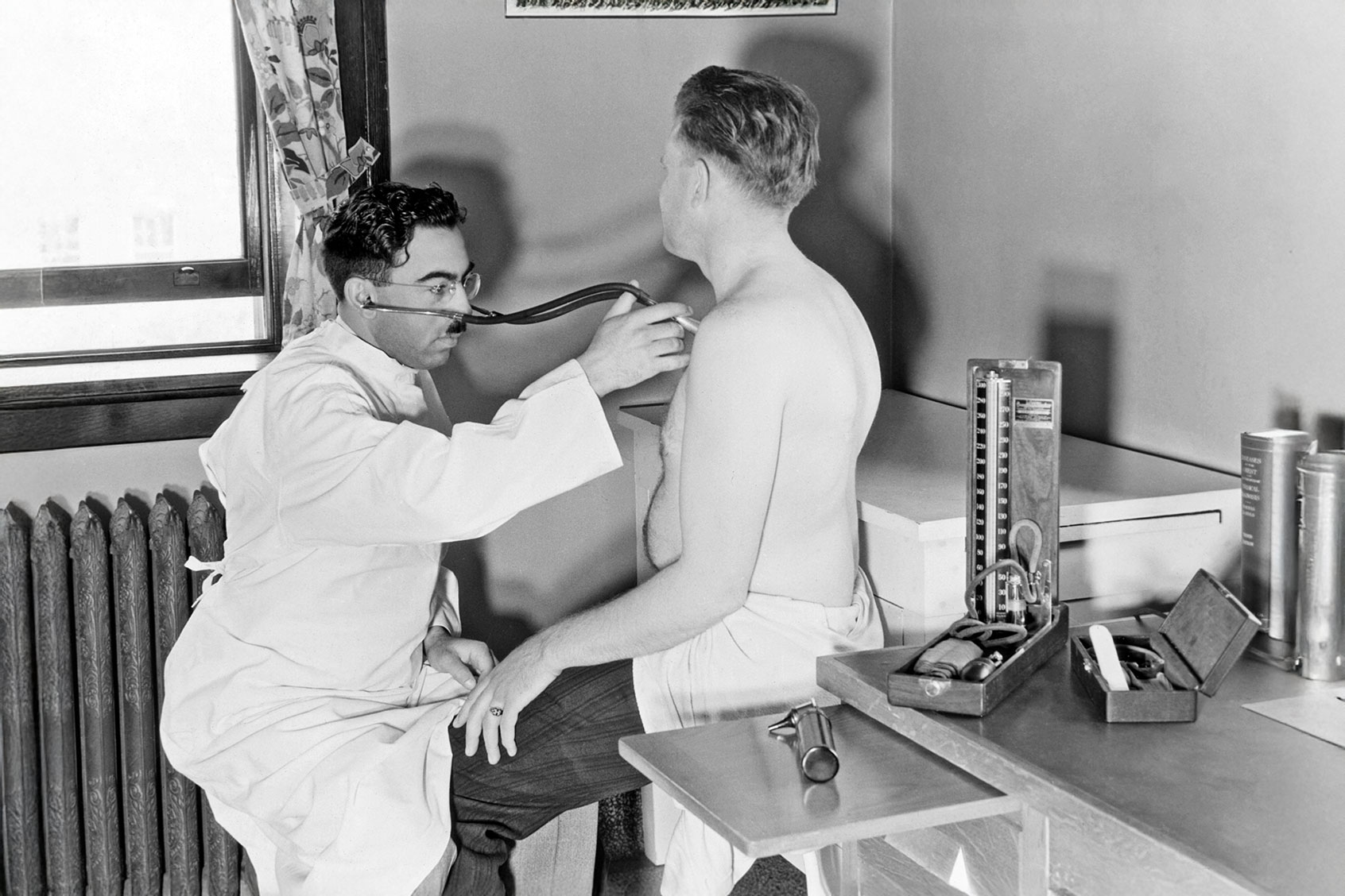 Doctor physician examining patent for tuberculosis