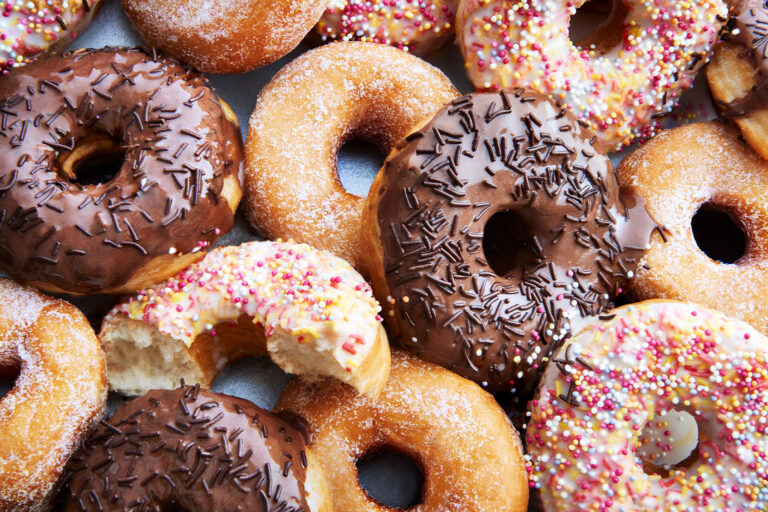 A mixture of iced chocolate and regular ring doughnuts. (Getty Images/Scott Grummett)