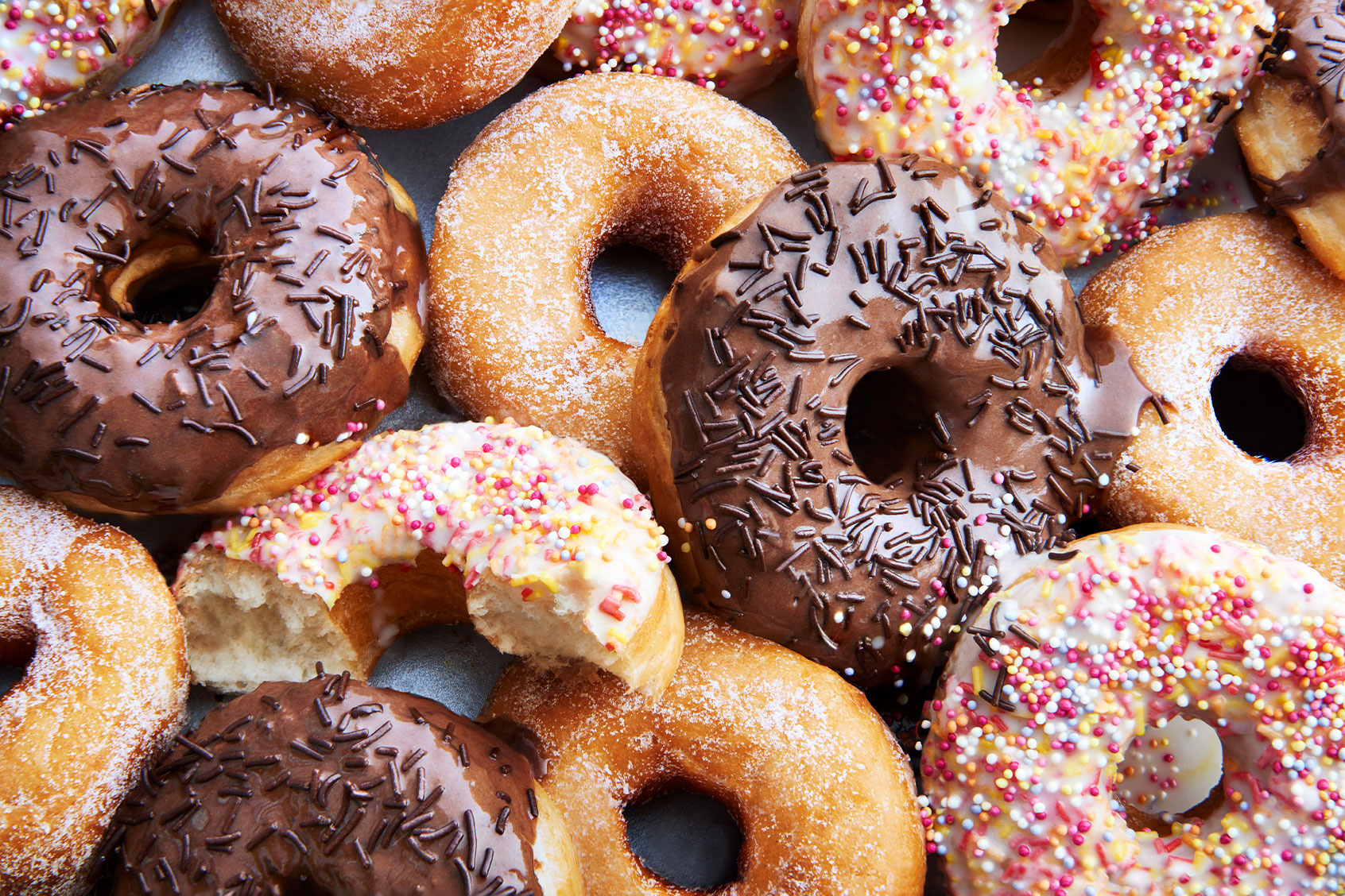 A mixture of iced chocolate and regular ring doughnuts. (Getty Images/Scott Grummett)