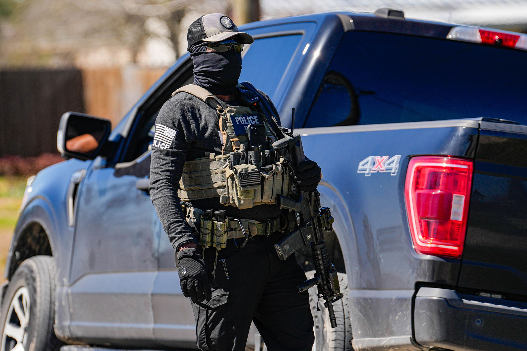 A Federal agent is photographed as ICE conduct raids on a local tire shop business in Colony Ridge on Monday, Feb. 24, 2025. (Raquel Natalicchio/Houston Chronicle via Getty Images)