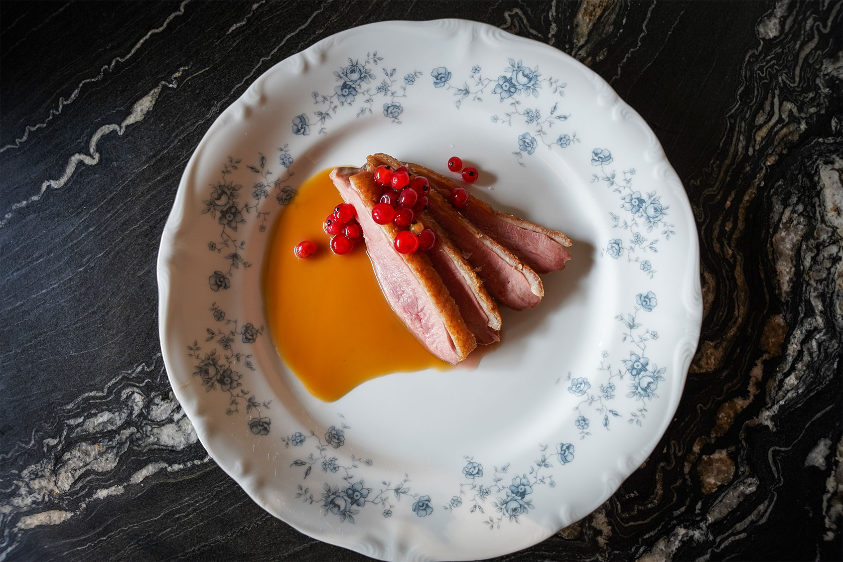 Duck dish with a red wine vinegar gastrique and pickled lingonberries served at Myriel. (Courtesy of Karyn Tomlinson)