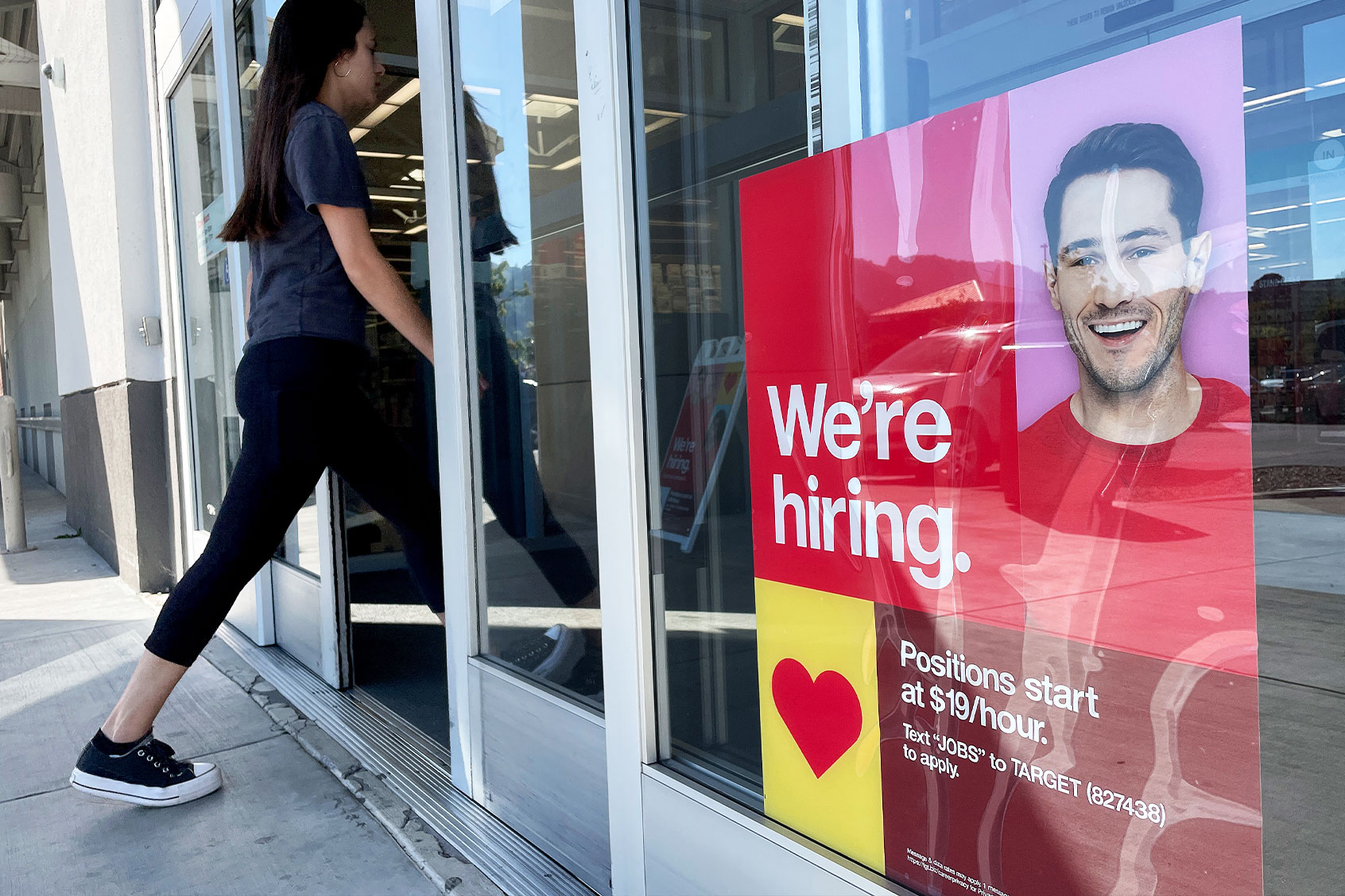 A customer walks by a now hiring sign posted in front of Target store on November 03, 2023 in Sausalito, California. (Justin Sullivan/Getty Images)