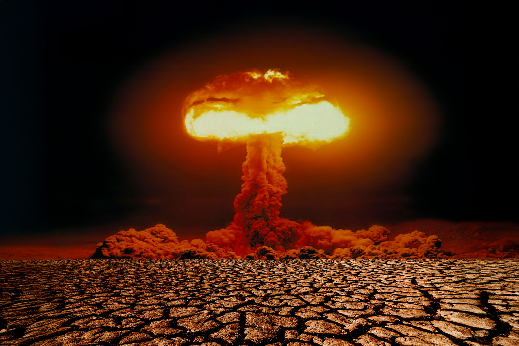 Nuclear explosion with mushroom cloud on scorched earth (Getty Images/Anton Petrus)