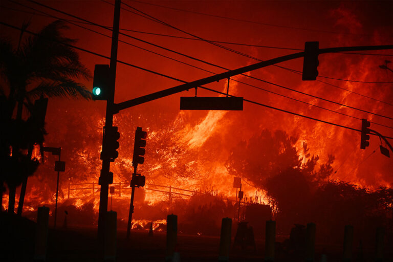 Flames overtake the intersection of Temescal Canyon and Pacific Coast Highway Fire at the Palisades Fire in Pacific Palisades California on January 7, 2025. (ROBYN BECK/AFP via Getty Images)