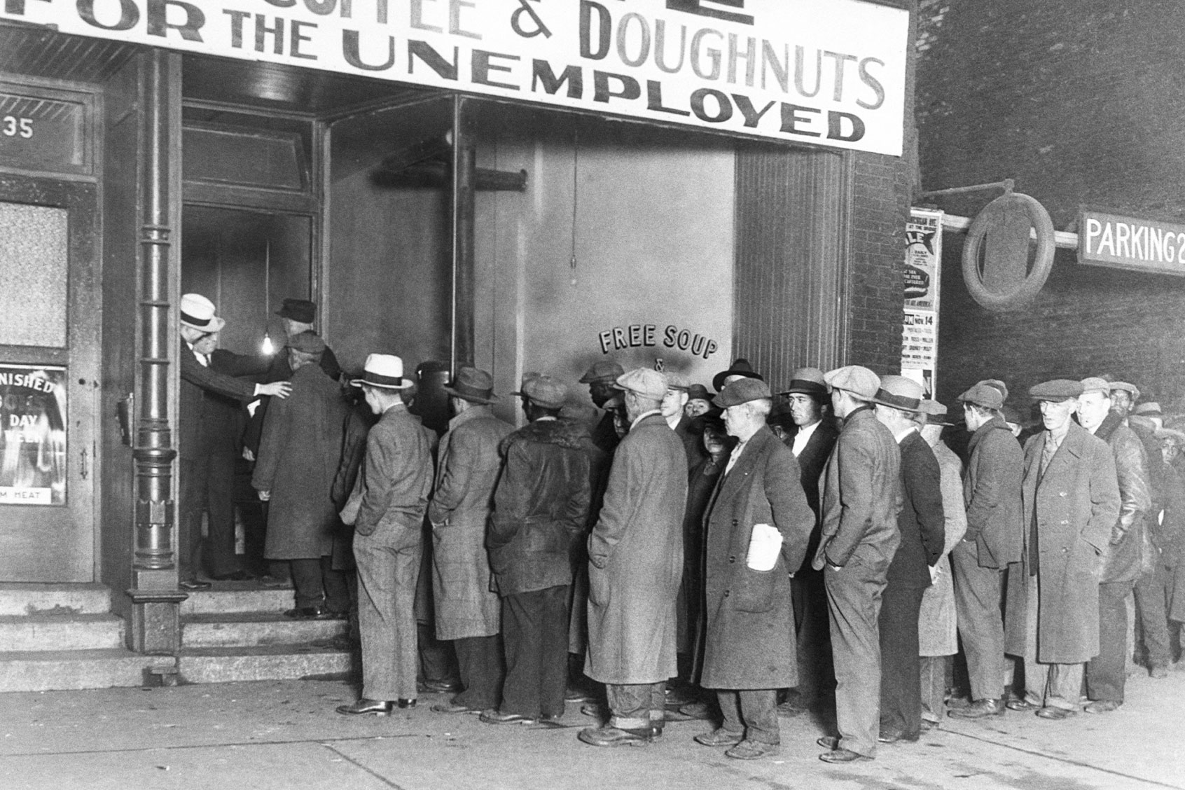 Unemployed men line at "Big Al's Kitchen for the Needy," which provides three meals a day consisting of soup with meat, bread, coffee, and doughnuts, feeding about 3500 people daily. (Getty Images/Bettmann )