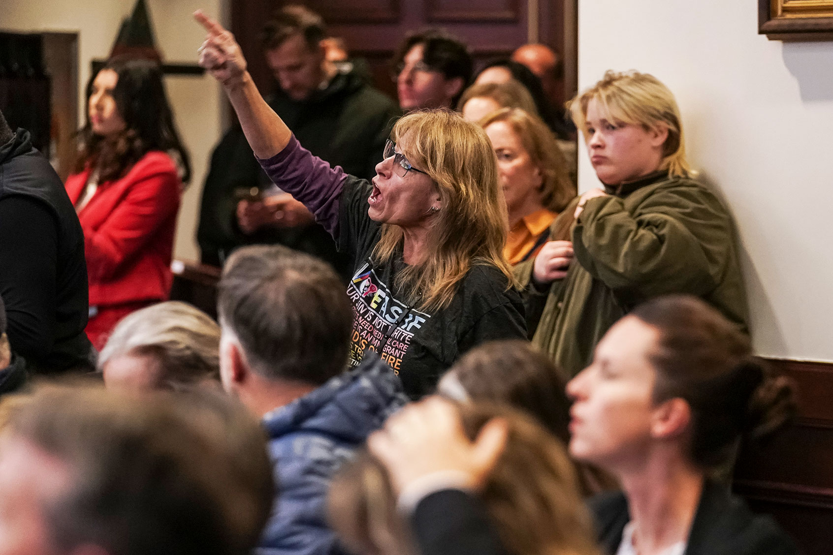An attendee yells out in response to an answer by Republican U.S. Rep. Rich McCormick during a town hall meeting on Thursday, February 20, 2025 in Roswell, GA. (Elijah Nouvelage for The Washington Post via Getty Images)