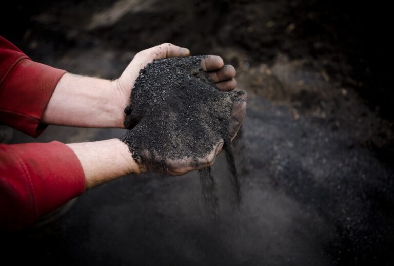 Poultry farmer Josh Frye churns out biochar from chicken waste and wood chips, turning it into a valuable fertilizing substance which is also environmentally clean on November 26, 2008 in Wardensville, West Virginia. (Photo by Jeff Hutchens/Getty Images)