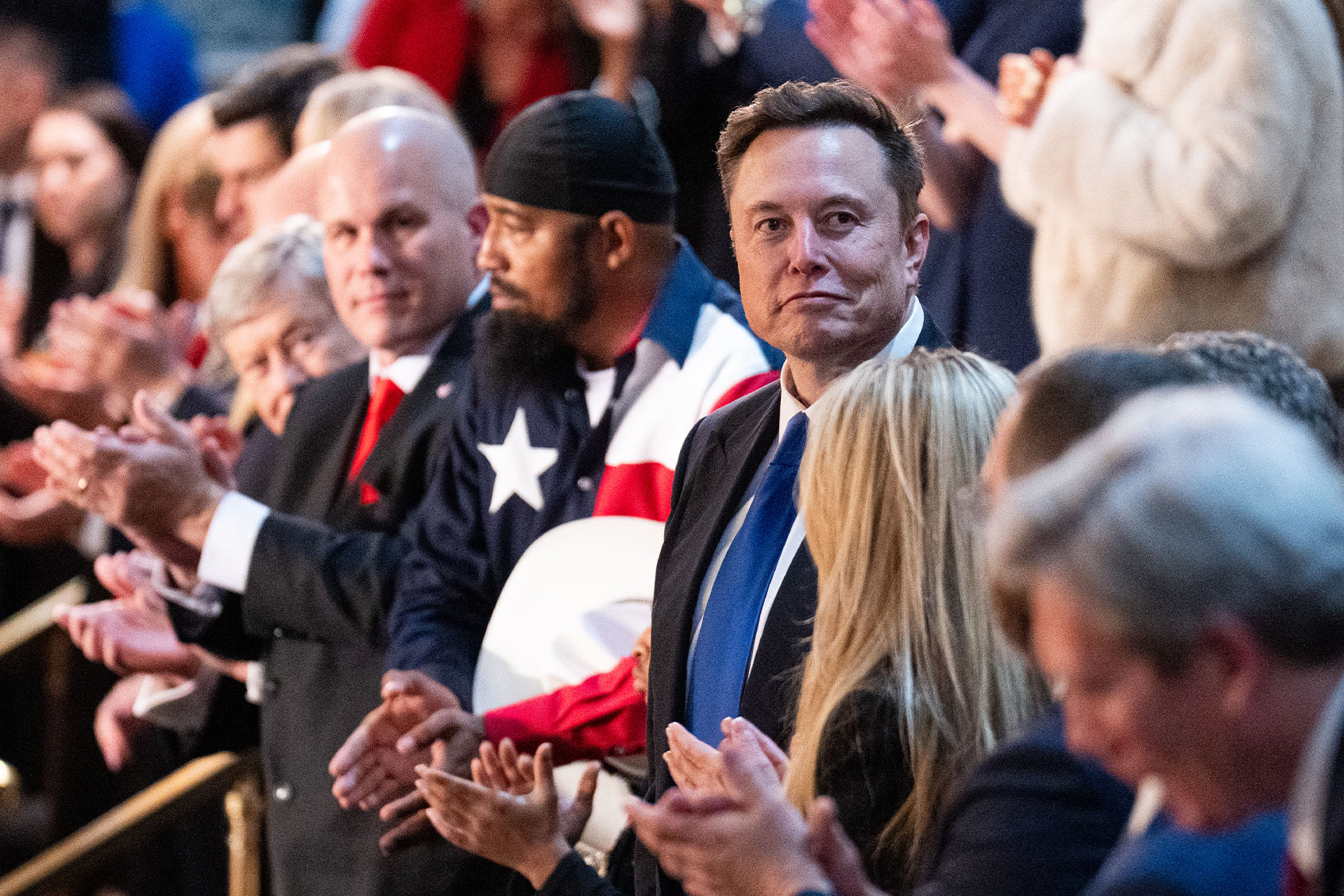 Elon Musk stands in the gallery during President Donald Trump's address to a joint session of Congress in the U.S. Capitol on Wednesday, March 4, 2025. (Bill Clark/CQ-Roll Call, Inc via Getty Images)