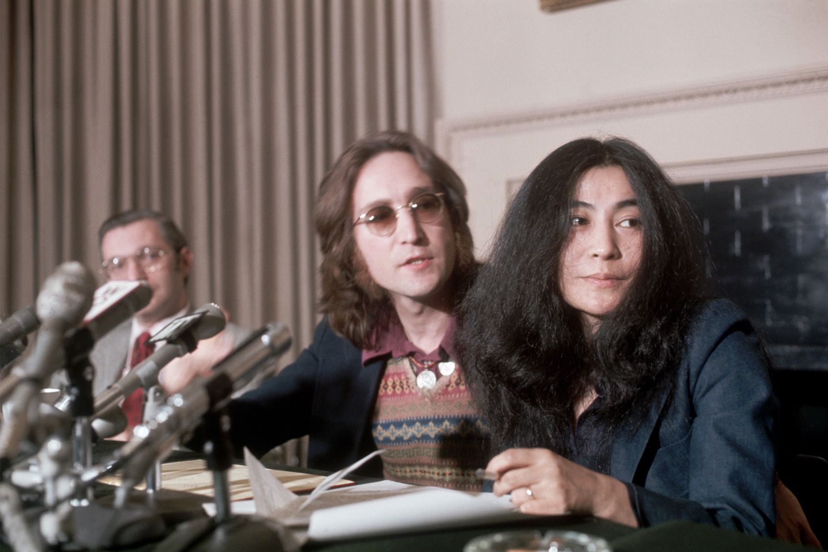 John Lennon, a former "Beatle" with wife, Yoko Ono, during a press conference on April 2, 1973. (Bettmann / Getty Images)