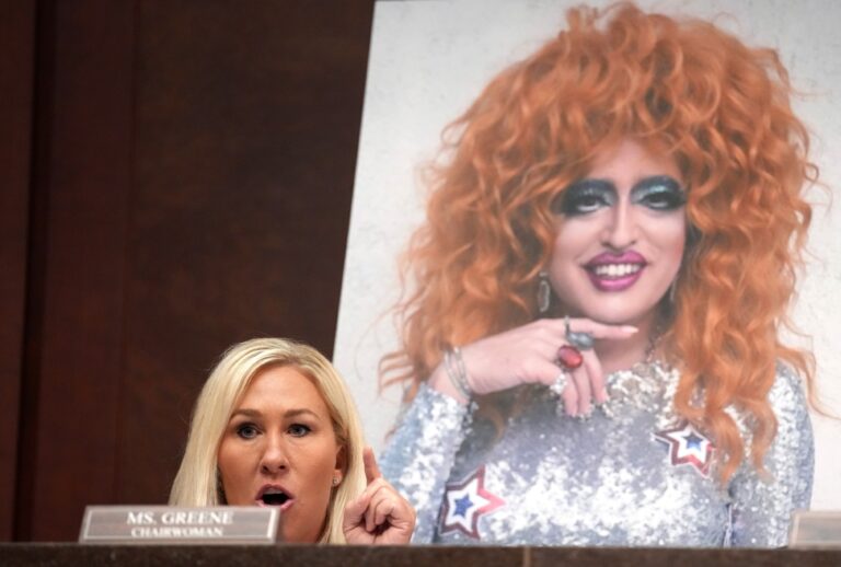 Rep. Marjorie Taylor Greene (R-GA) speaks in front of a photo of drag queen Lil Miss Hot Mess during a House Oversight and Government Reform Committee hearing at the U.S. Capitol on March 26, 2025 in Washington, DC. (Andrew Harnik/Getty Images)