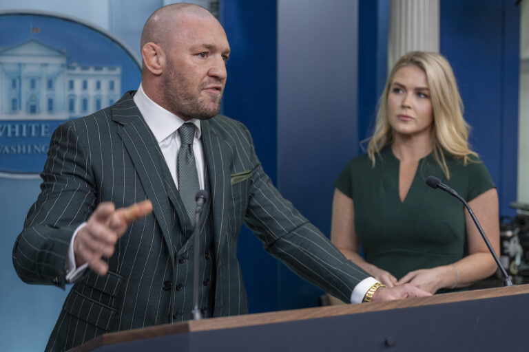 Conor McGregor speaks from the White House briefing room podium with White House Press Secretary Karoline Leavitt, March 17, 2025. (Jim Watson/AFP via Getty Images)