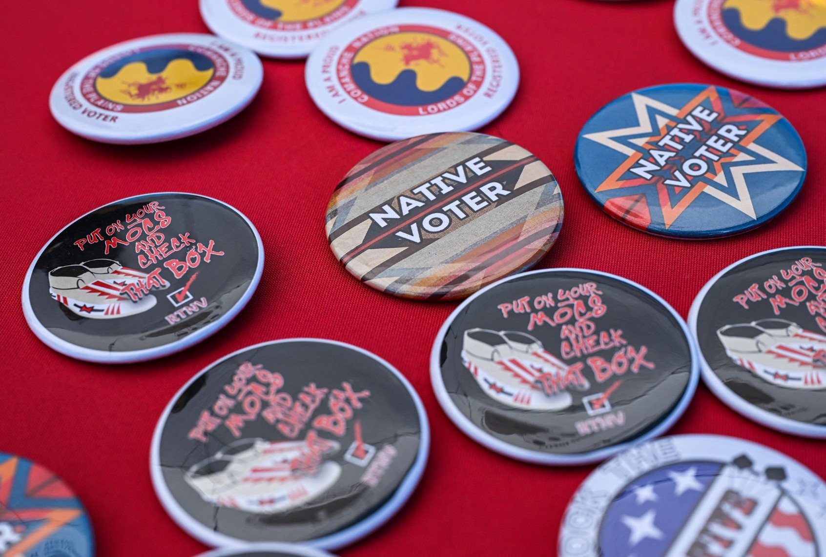 Pins are pictures are pictured at a display counter during a cultural meeting at the Comanche Nation fairgrounds in Lawton, Oklahoma on September 30, 2023. (CHANDAN KHANNA/AFP via Getty Images)