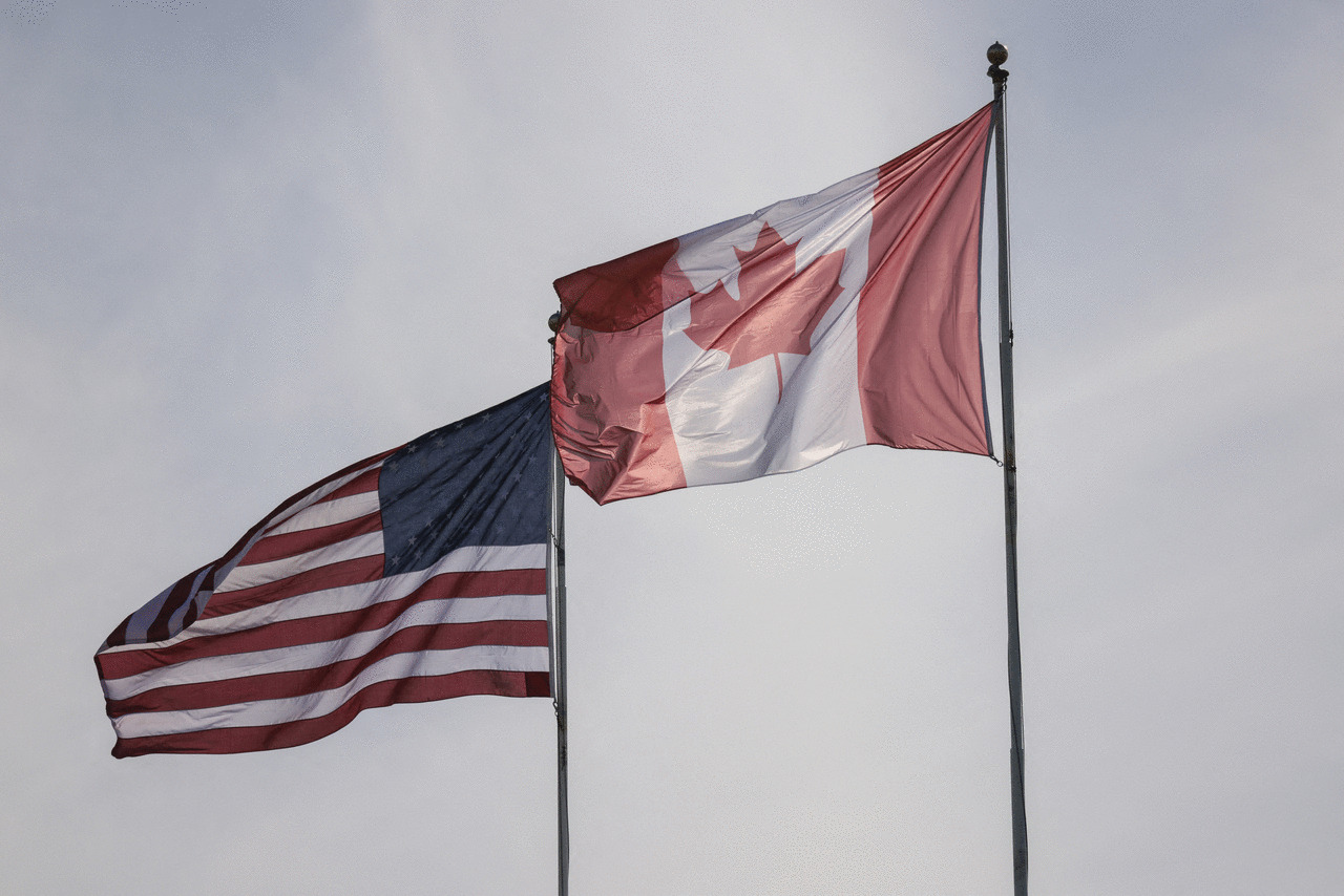 The US and Canadian flags are pictured at Peace Arch Historical State Park in Blaine, Washington, on March 5, 2025.) (Jason Redmond / AFP) (Photo by JASON REDMOND/AFP via Getty Images)