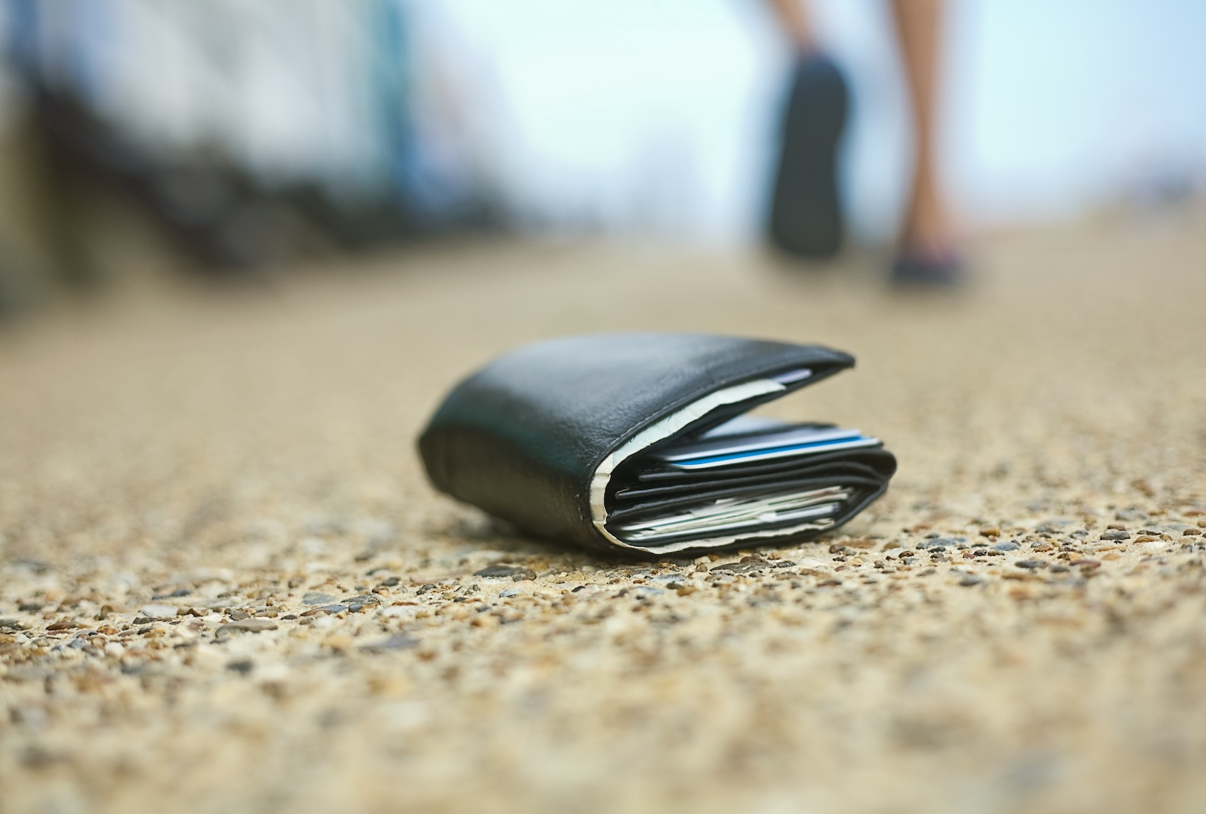 Lost wallet lying on ground. (Westend61 / Getty Images)
