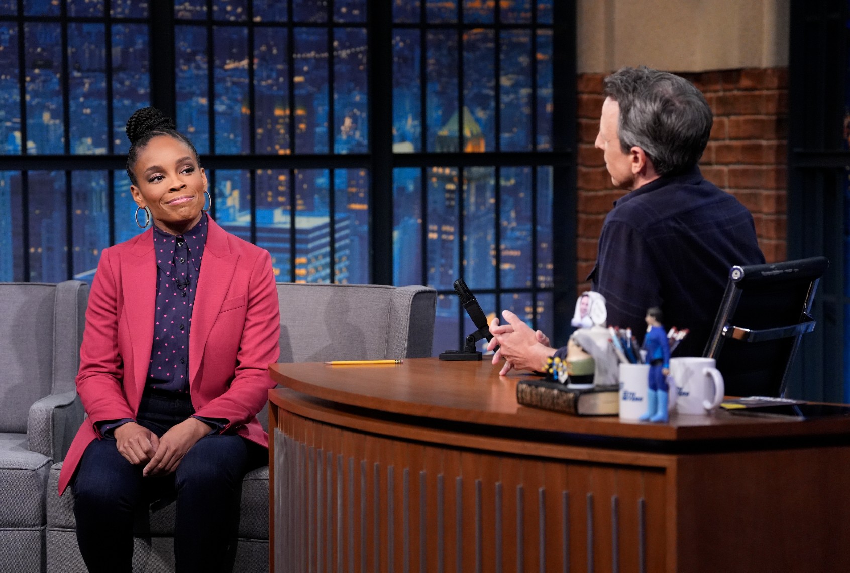 (l-r) Amber Ruffin and Seth Meyers during the sketch "Both Sides" on Monday, March 31, 2025 (Lloyd Bishop/NBC)