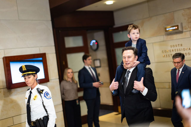 Elon Musk, the richest man in the world, walks through the Capitol Hill, with his child, in regards to Department of Government Efficiency meetings on December 5, 2024 in Washington, DC. (Maansi Srivastava for The Washington Post via Getty Images)