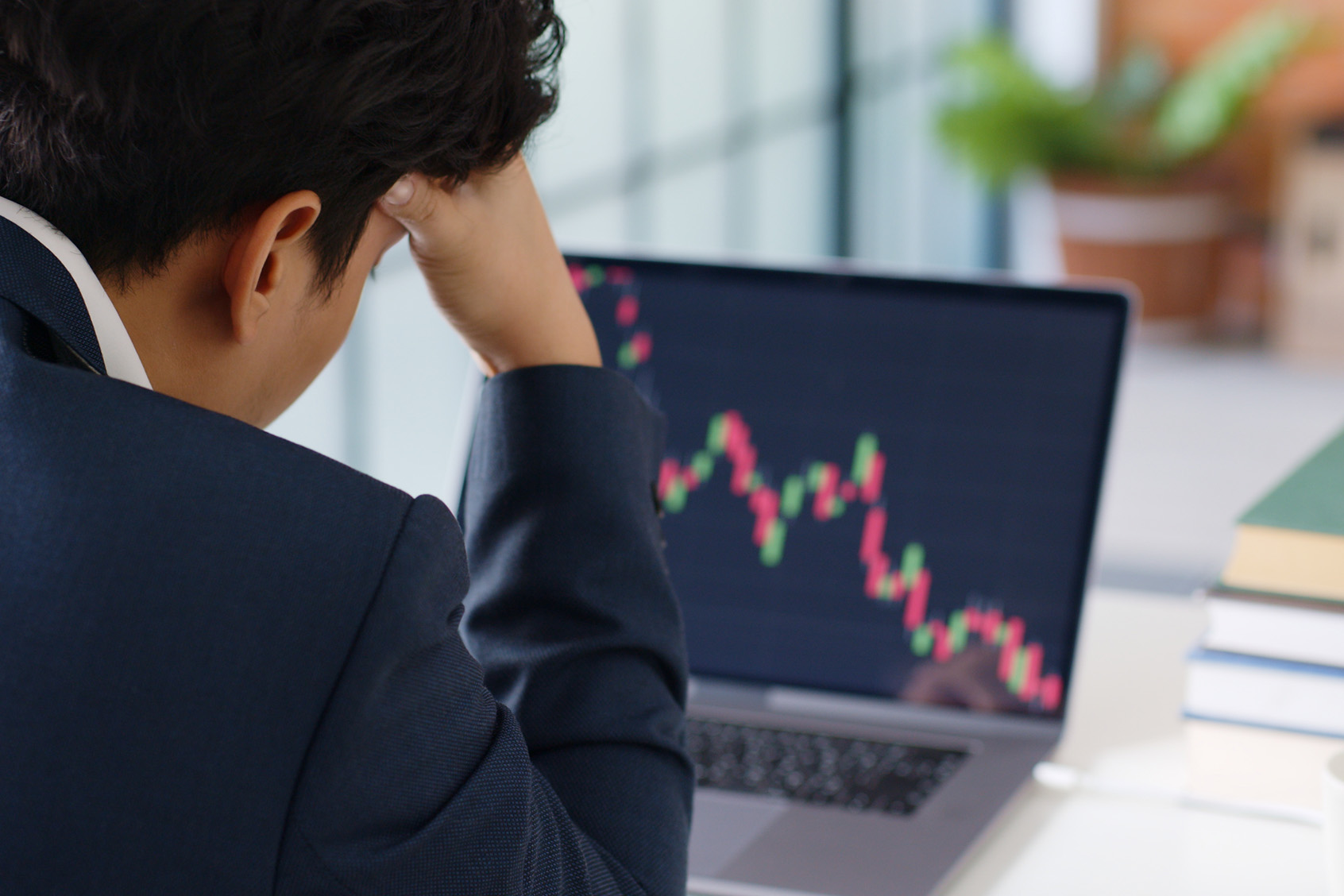 Stressed businessman feeling desperate on crisis stock market, investment concept (Getty Images/Nattakorn Maneerat)