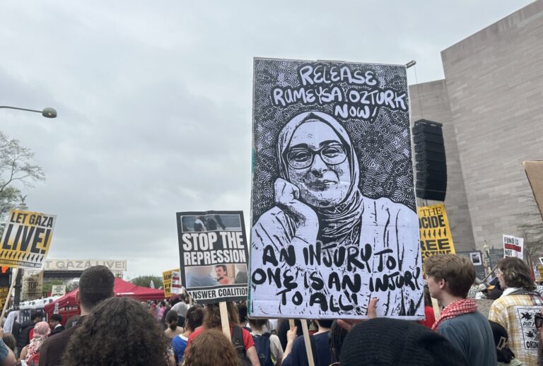 A protester at the Gaza march in Washington holds a photo of Turkish Tufts University student Rumeysa Ozturk on April 5, 2025, in Washington DC, United States. (Rabia Iclal Turan/Anadolu via Getty Images)