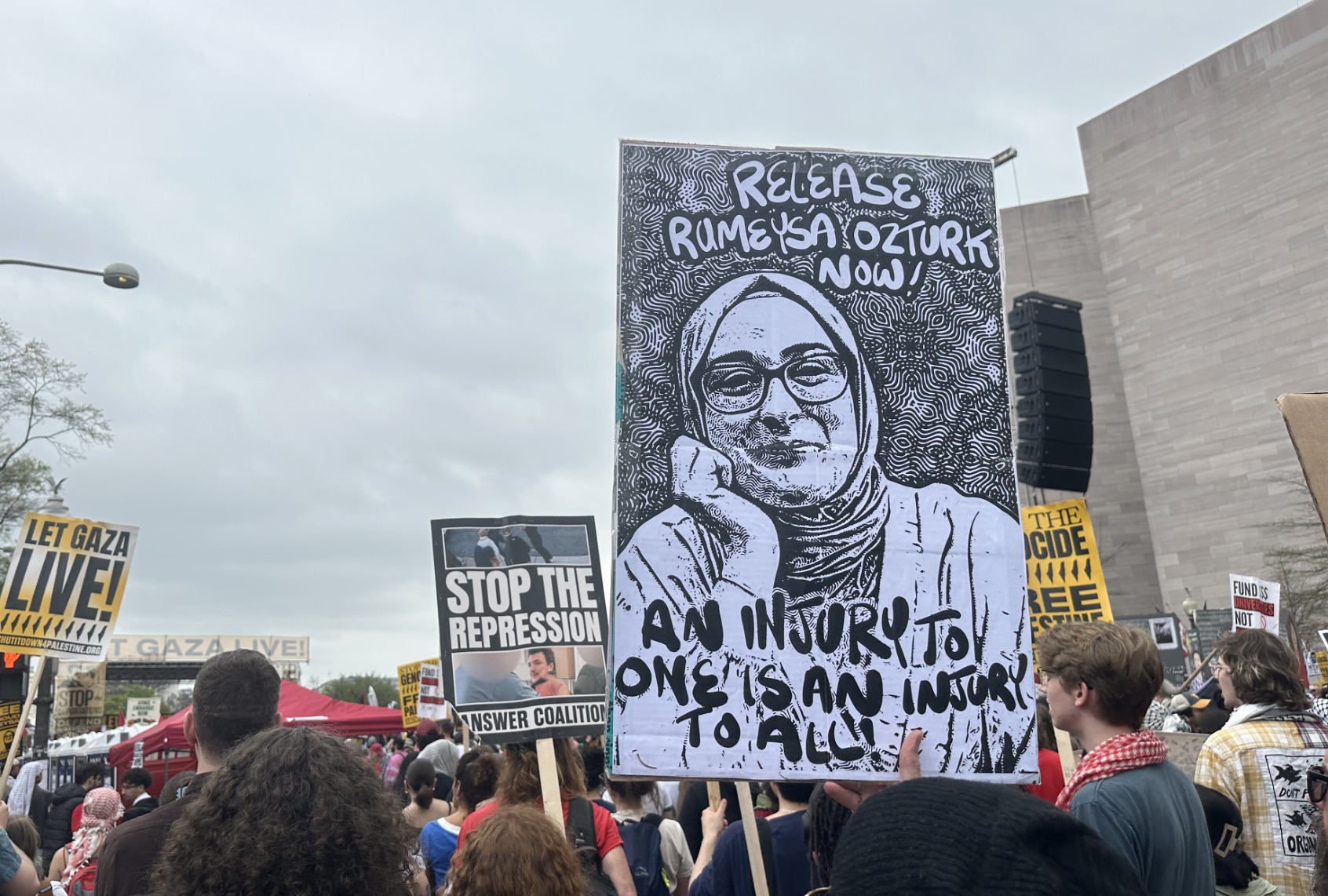 A protester at the Gaza march in Washington holds a photo of Turkish Tufts University student Rumeysa Ozturk on April 5, 2025, in Washington DC, United States. (Rabia Iclal Turan/Anadolu via Getty Images)
