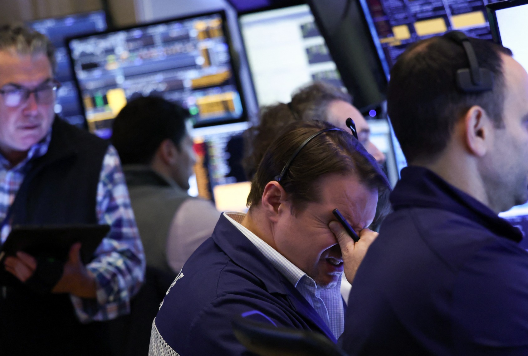 Traders work on the floor of the New York Stock Exchange (NYSE) at the opening bell in New York City, on April 3, 2025. Wall Street stocks sank in early trading on April 3,2025, joining a global equity selloff after President Donald Trump's latest tariff announcement exacerbated worries about a trade war and global economic downturn. (CHARLY TRIBALLEAU/AFP via Getty Images)
