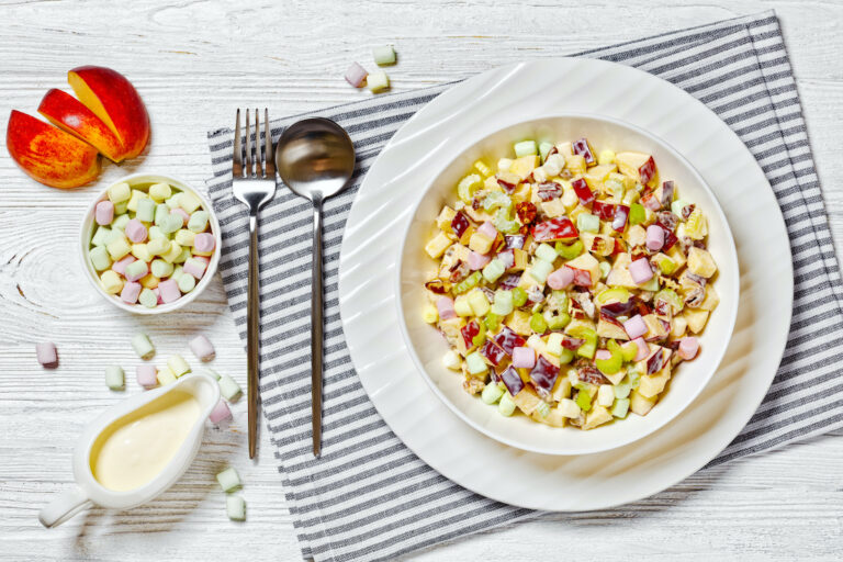 A sweet apple salad with marshmallows, crushed nuts and a yogurt dressing (Getty Images / from-my-point-of-view)